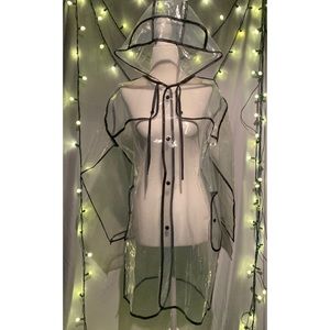 Transparent rain jacket with black seams